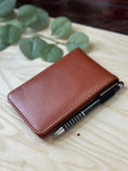 Load image into Gallery viewer, Personalised PU Leather A7 Notepad Holder – Custom Laser Engraved Pocket Notebook with Pen, Durable & Elegant Gift (Brown or Black) Krevana Personalised PU Leather A7 Notepad Holder – Custom Laser Engraved Pocket Notebook with Pen, Durable & Elegant Gift (Brown or Black)