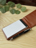 Load image into Gallery viewer, Personalised PU Leather A7 Notepad Holder – Custom Laser Engraved Pocket Notebook with Pen, Durable & Elegant Gift (Brown or Black) Krevana Personalised PU Leather A7 Notepad Holder – Custom Laser Engraved Pocket Notebook with Pen, Durable & Elegant Gift (Brown or Black)