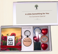 Load image into Gallery viewer, A Krevana gift box set displayed open on a light beige background. The set includes a red poppy sticky notepad with the quote 'It's your own limit is your mind', a round wooden keychain reading 'You are the Best Ever', milk and dark chocolate hearts, a small tin of gourmet chocolates,