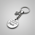 Load image into Gallery viewer, A silver-toned metal keychain with a round engraved disc charm reading 'A little Reminder: You Are Loved Emilé', a small turtle-like charm, and a split key ring, shown on a light gray background.