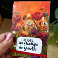 Load image into Gallery viewer, Notepad holder with Wildflower Meadow original artwork print with inspiration message and the text white label reads 'No change no growth.
