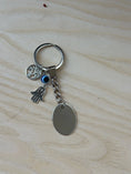 Load image into Gallery viewer, Personalised Stainless Steel Keychain – Custom Engraved Keyring with Hamsa Hand & Tree of Life Charms, Zodiac or New Home Gift Krevana Personalised Stainless Steel Keychain – Custom Engraved Keyring with Hamsa Hand & Tree of Life Charms, Zodiac or New Home Gift
