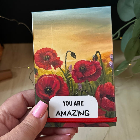 Notepad holder with Poppy Field original artwork print with inspiration message and the text 'YOU ARE AMAZING' on a white label.