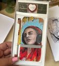 Load image into Gallery viewer, Personalised Christmas gift set with Lost in Sound art bookmark, white rose gold pen and three chocolates in a gift box
