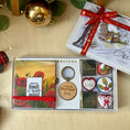 Load image into Gallery viewer, A thoughtful small gift set with a poppy notepad, wooden keychain, optional name personalisation and six chocolates.
