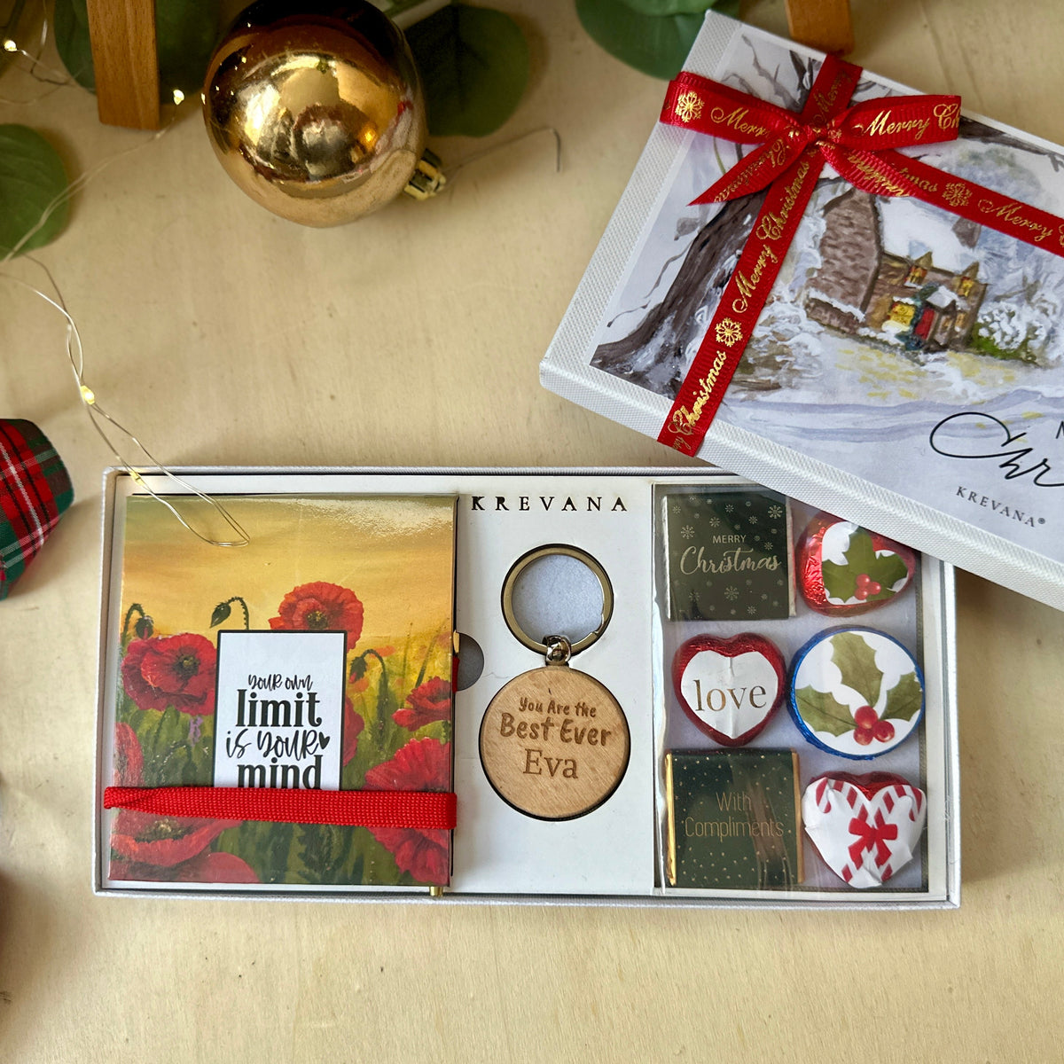 A thoughtful small gift set with a poppy notepad, wooden keychain, optional name personalisation and six chocolates.