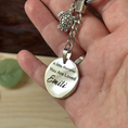 Load image into Gallery viewer, A silver-toned engraved keychain with a turtle charm and a round pendant reading 'A little Reminder: You Are Loved Emili', held in a person's hand.
